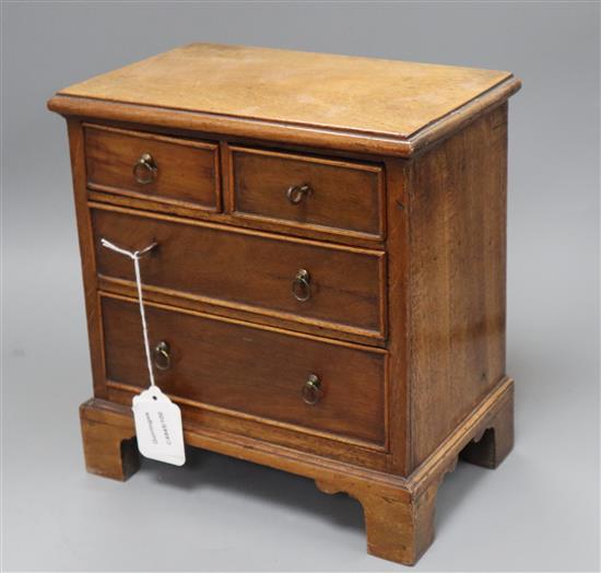 A miniature mahogany chest height 27.5cm width 26cm
